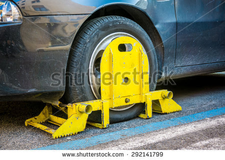 stock-photo-rome-italy-february-clamped-wheel-of-a-car-illegally-parked-292141799